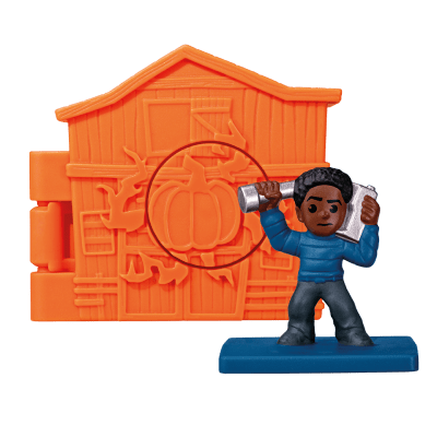 A dark orange toy house with a Lucas toy inside